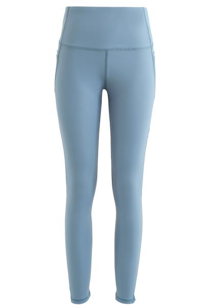 Leggings tobilleros con detalle de costuras de tiro alto y bolsillos de malla en azul