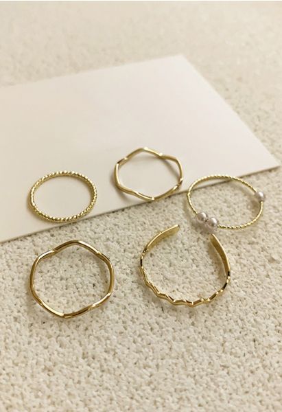 Anillos de oro perla simple de cinco piezas