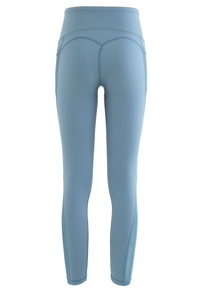 Leggings tobilleros con detalle de costuras de tiro alto y bolsillos de malla en azul