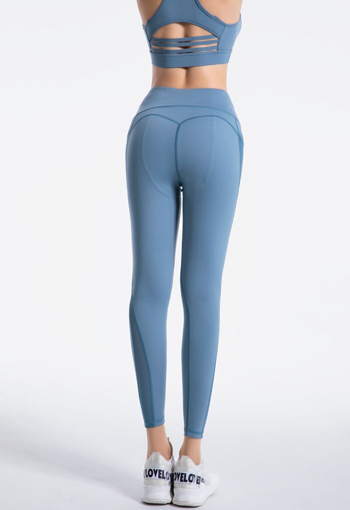 Leggings tobilleros con detalle de costuras de tiro alto y bolsillos de malla en azul