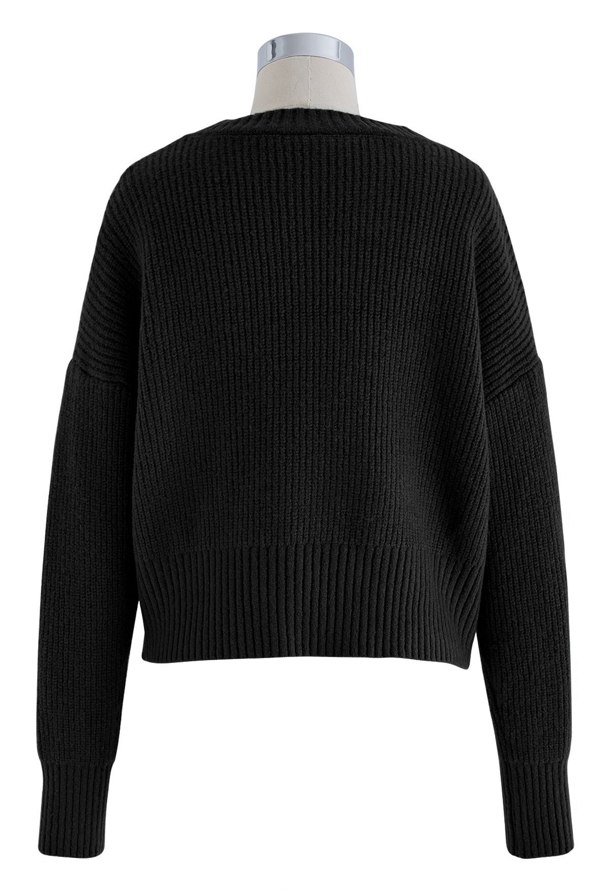 Suéter de punto con cuello redondo y nudo en negro