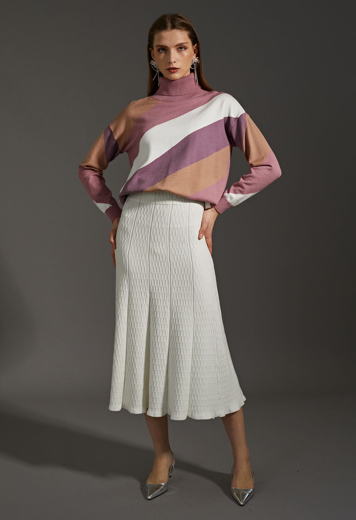 Suéter de punto de cuello alto con bloques de color a rayas en rosa