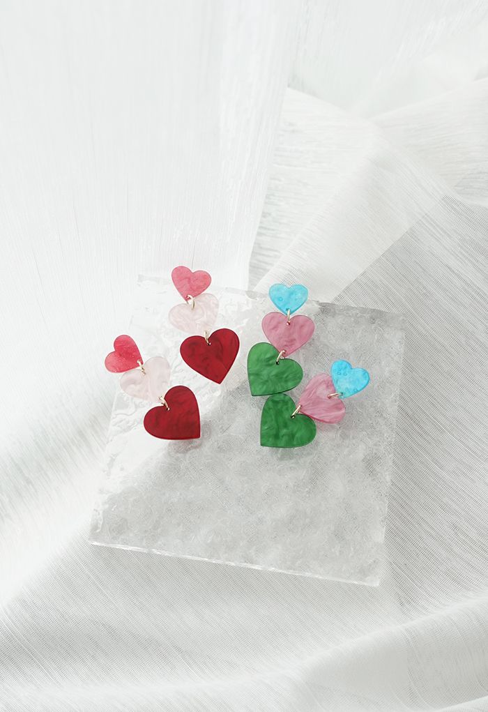 Aretes colgantes de corazones triples