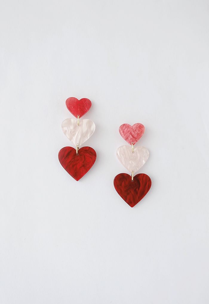 Aretes colgantes de corazones triples