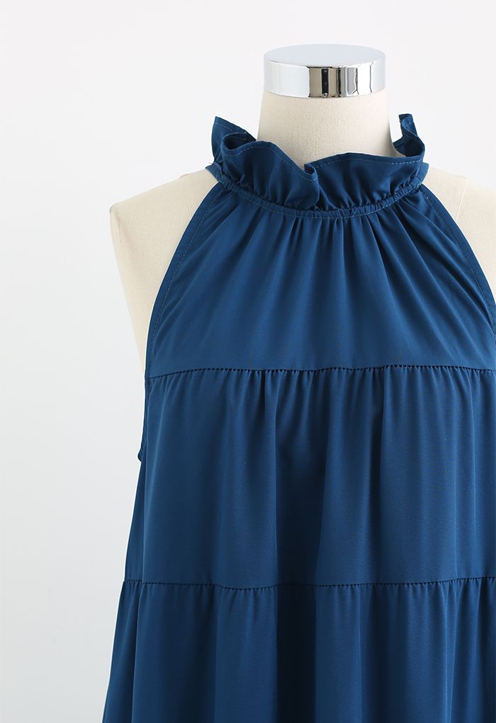 Vestido a media pierna con cuello halter y volantes con lazo anudable