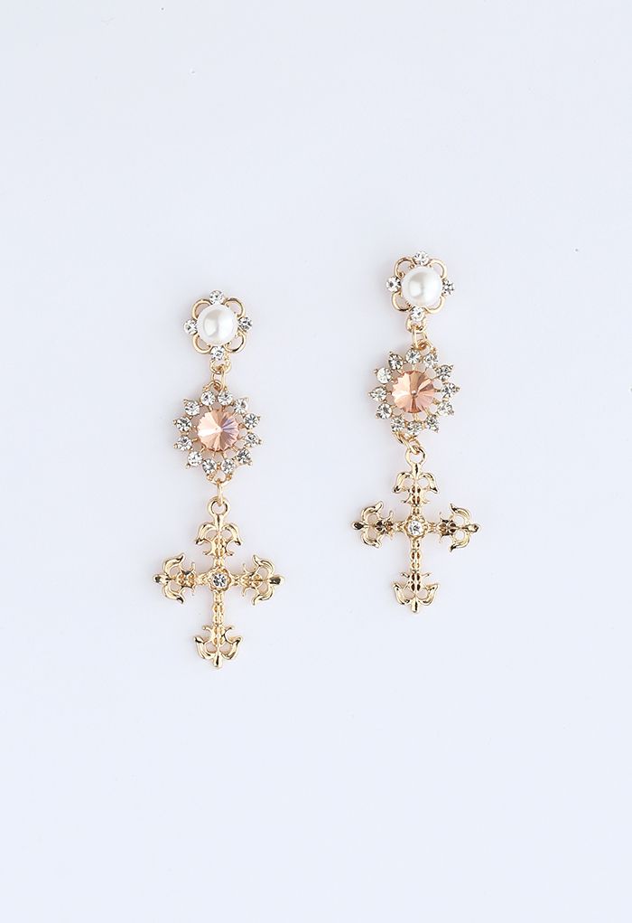 Aretes colgantes con cristales cruzados y perlas decoradas