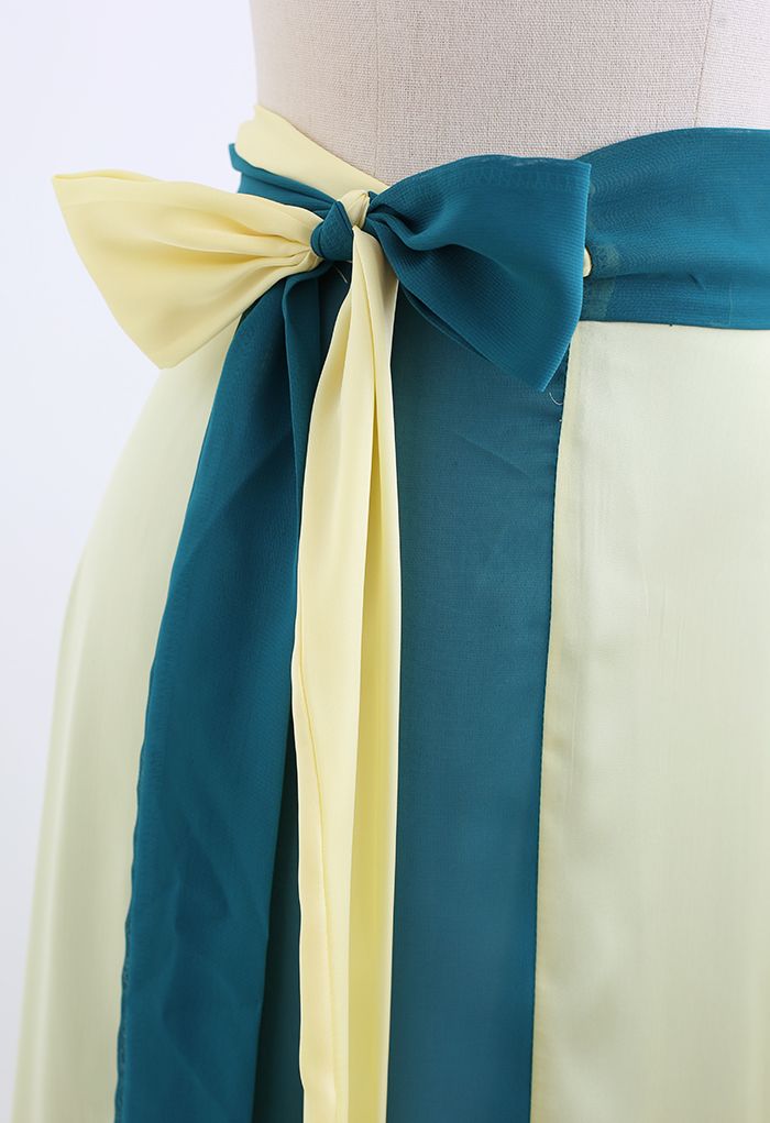 Falda larga cruzada empalmada con cintura anudada en verde azulado