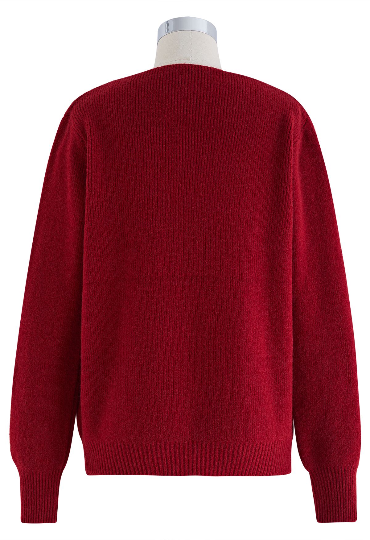 Suéter de punto con escote de perlas recortadas en rojo