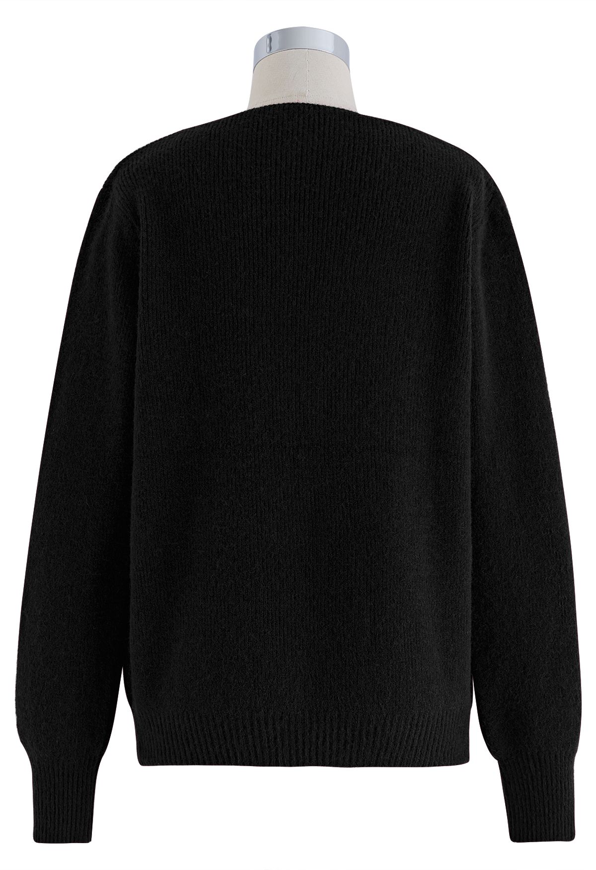 Suéter de punto con escote de perlas recortadas en negro