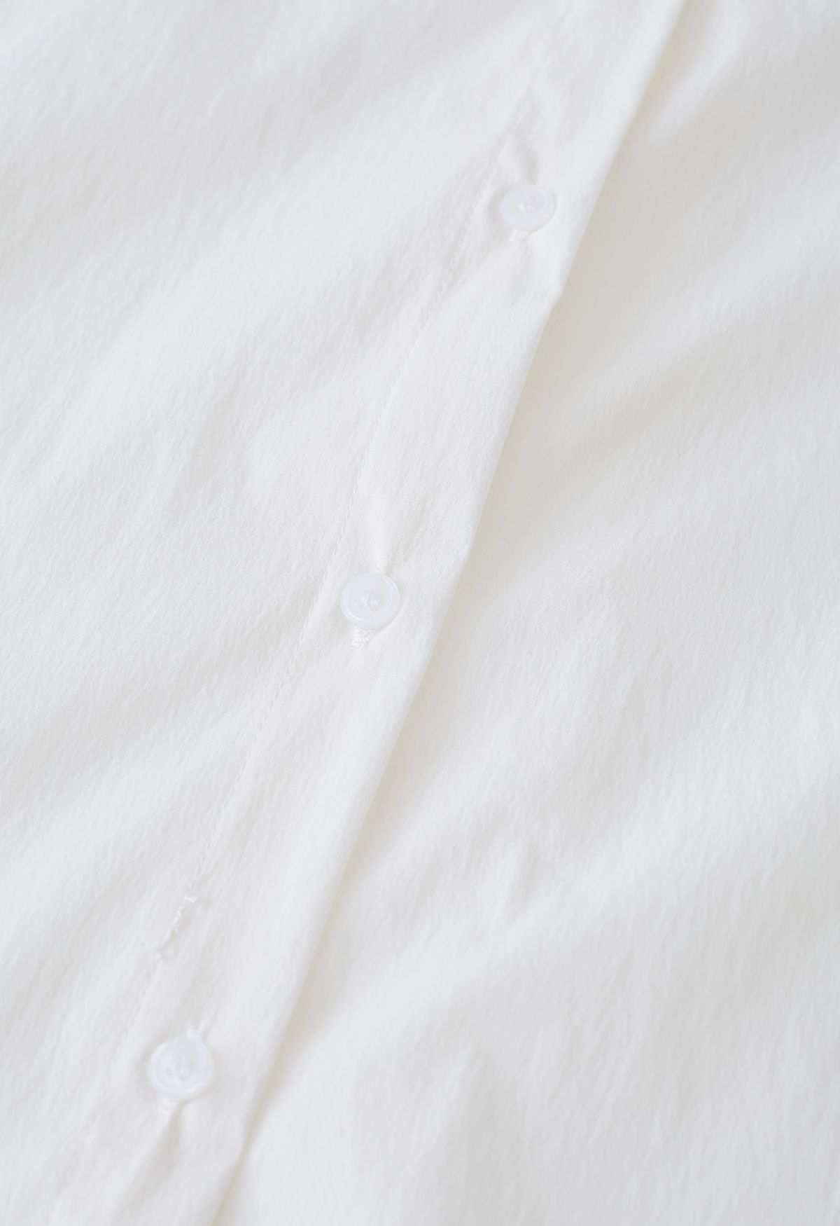 Camisa de algodón con parche plisado en crema