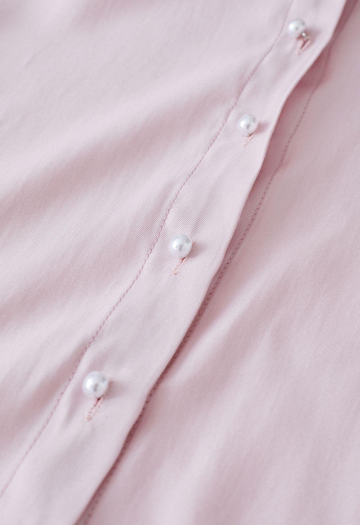 Camisa de organza con botones y lazo en rosa