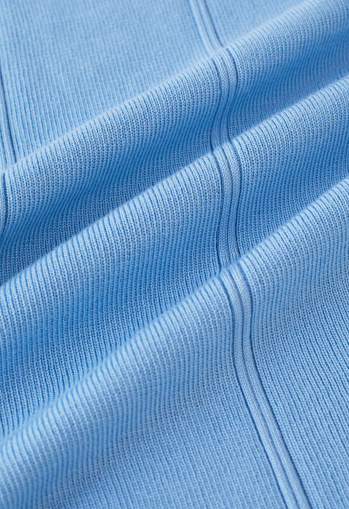 Conjunto de top de punto con lazo en la cintura y falda lápiz en azul