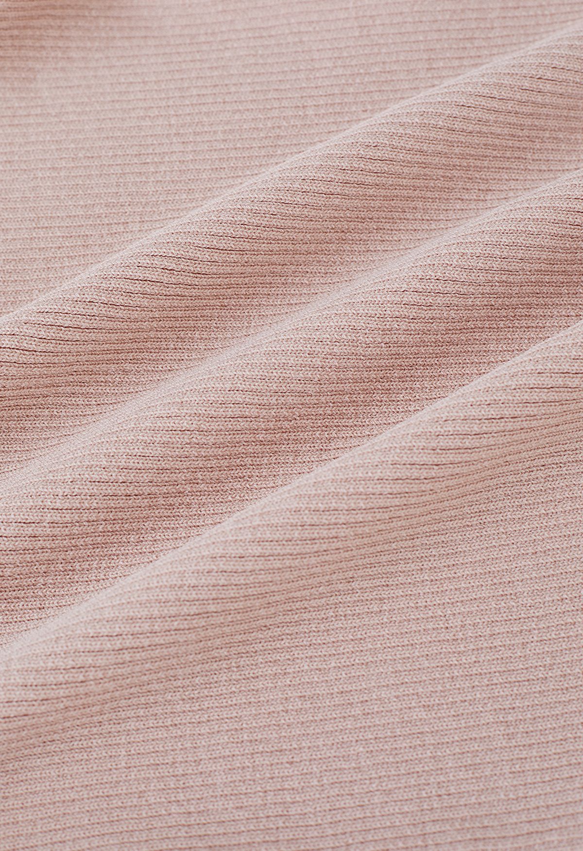 Top corto de punto con mangas onduladas escalonadas empalmadas en rosa