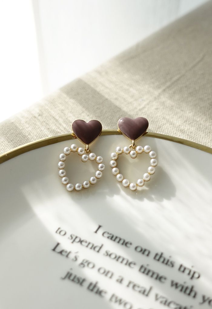 Aretes colgantes de corazones dobles