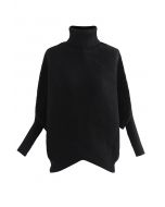 Suéter de punto asimétrico con mangas de murciélago y cuello alto en negro