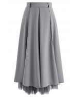 Falda midi con dobladillo empalmado de malla en gris