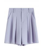 Shorts con bolsillos laterales con detalle plisado en azul