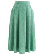 Falda midi de tweed plisada con bolsillo lateral